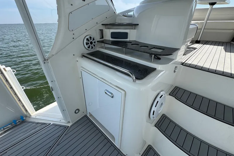 Slide: The Image of 2008 Cruisers Yachts 395 Motoryacht deck with built-in grill and ocean view. - 12