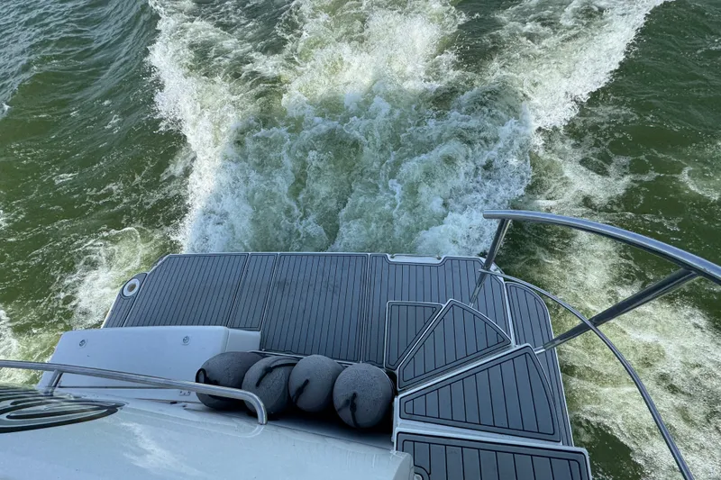 Slide: The Image of 2008 Cruisers Yachts 395 Motoryacht rear view, showing wake and swim platform. - 9
