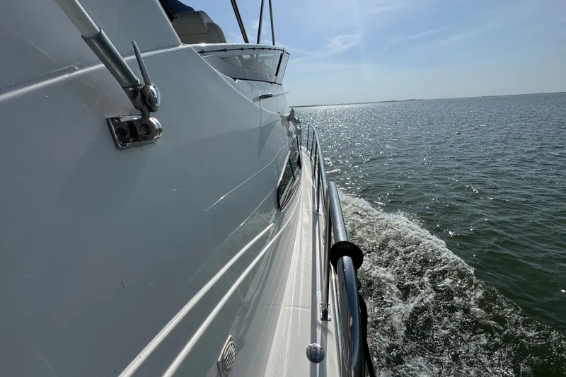Slide: The Image of 2008 Cruisers Yachts 395 Motoryacht cruising on open water under clear skies. - 7