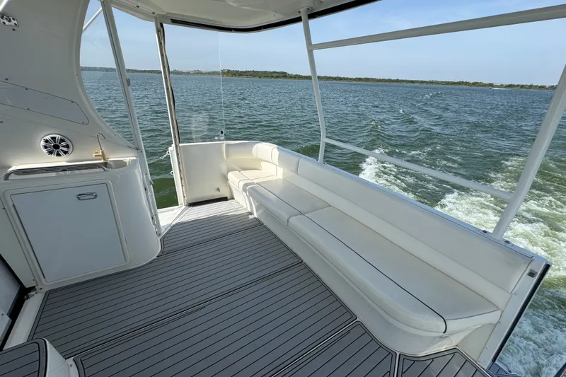 Slide: The Image of 2008 Cruisers Yachts 395 Motoryacht deck with seating, overlooking serene water view. - 11
