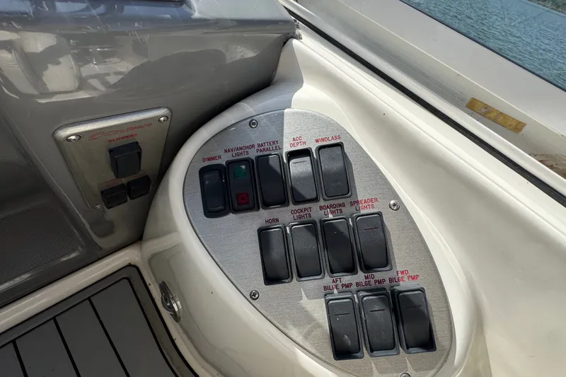 Slide: The Image of Control panel of a 2008 Cruisers Yachts 395 Motoryacht with labeled switches. - 29