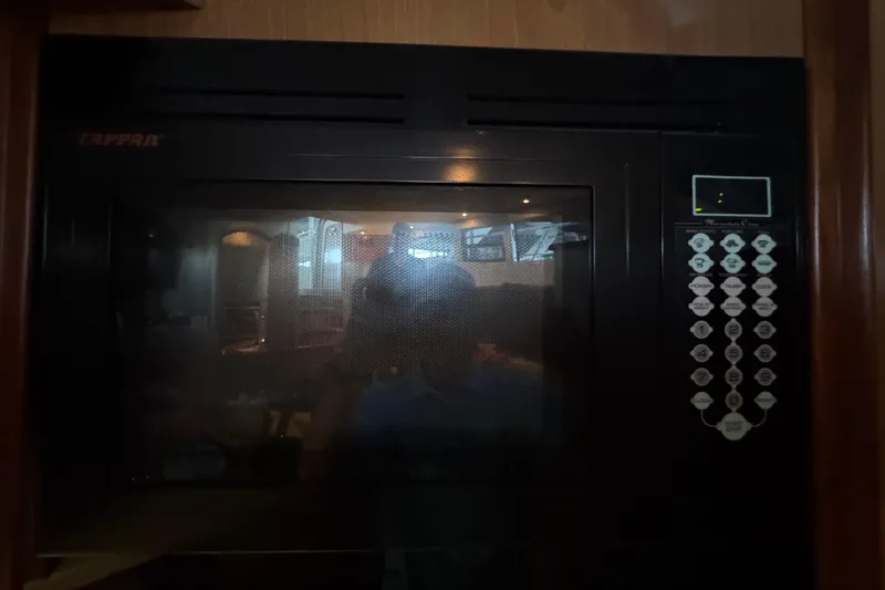 Slide: The Image of Microwave inside 2008 Cruisers Yachts 395 Motoryacht kitchen area. - 25