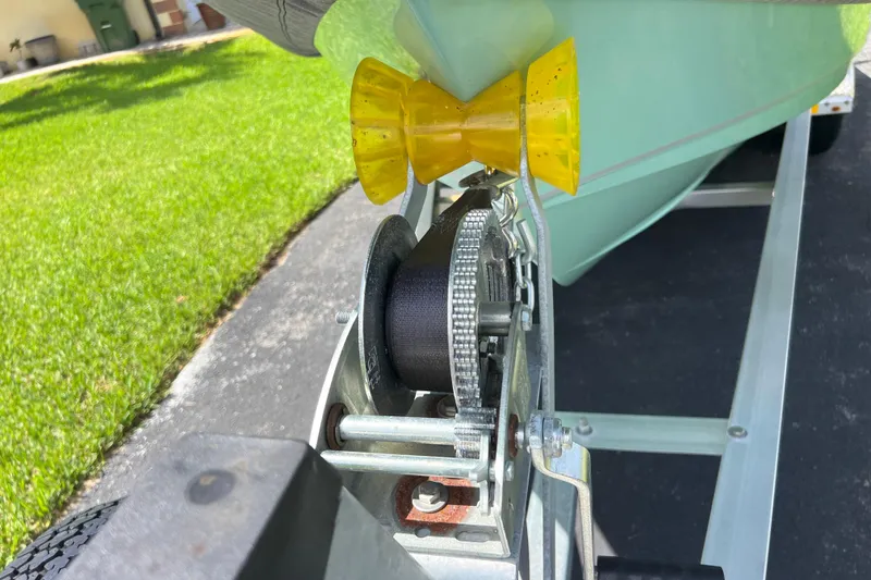 Slide: The Image of 2024 Sea Hunt BX 22 BR boat on trailer, close-up of winch and bow stop. - 14