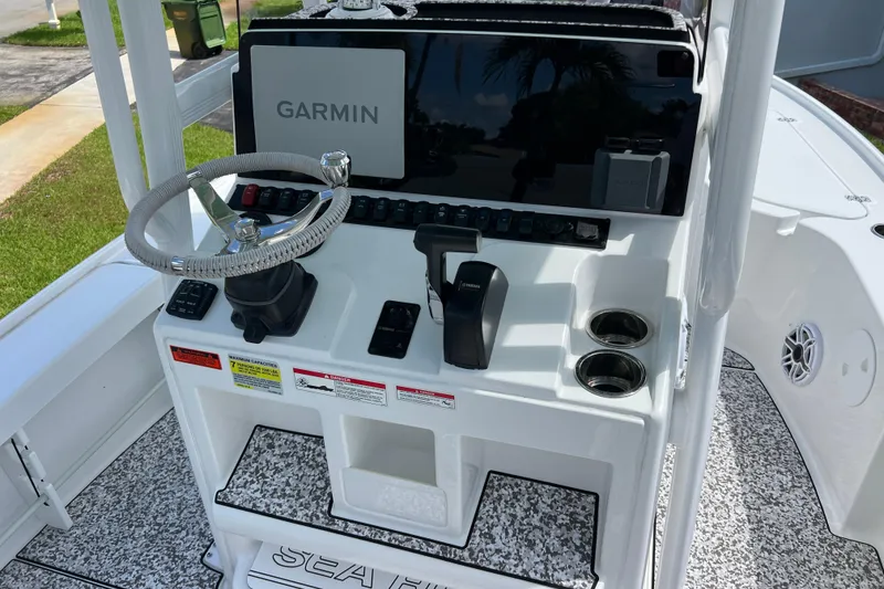 Slide: The Image of 2024 Sea Hunt BX 22 BR boat console with Garmin display and steering wheel. - 17