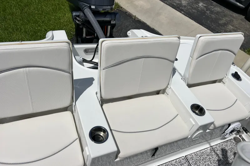 Slide: The Image of 2024 Sea Hunt BX 22 BR boat seats with cup holders, showcasing modern design. - 20