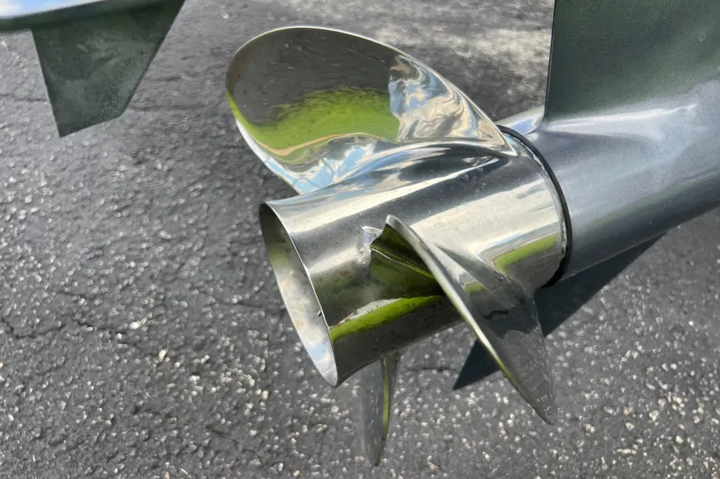 Slide: The Image of Close-up of a 2024 Sea Hunt BX 22 BR boat propeller on asphalt surface. - 3
