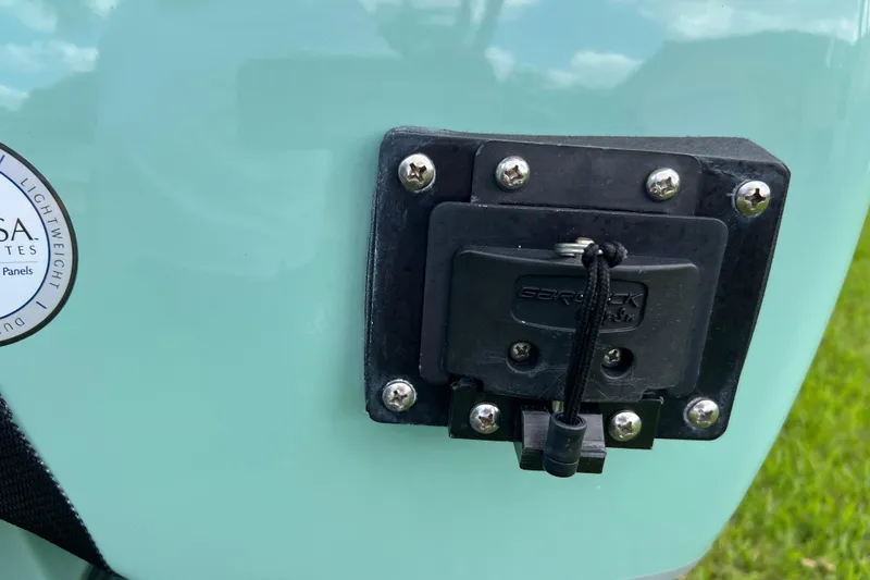 Slide: The Image of 2024 Sea Hunt BX 22 BR boat detail with mounted accessory on light blue hull. - 4