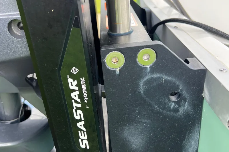 Slide: The Image of Close-up of SeaStar hydraulic steering system on 2024 Sea Hunt BX 22 BR boat. - 5