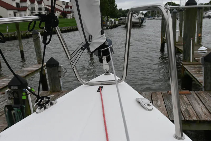 Slide: The Image of Bow view of 2022 Beneteau First 24 sailboat docked at marina. - 10