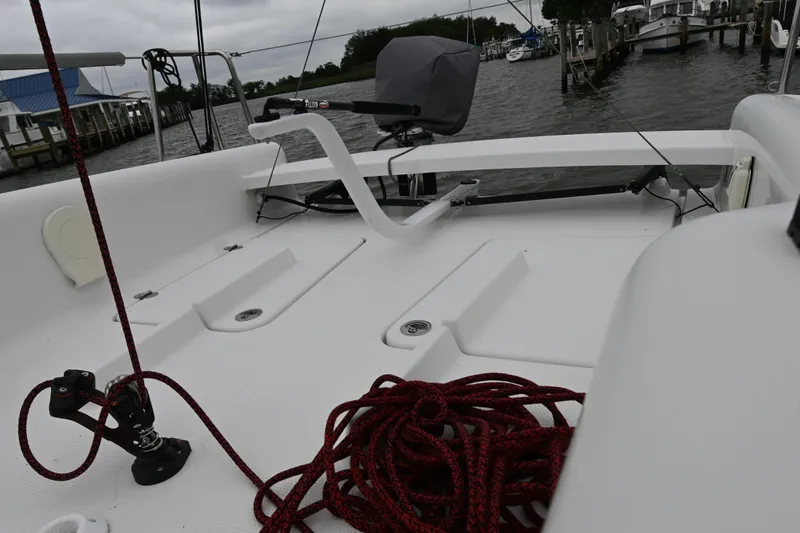 Slide: The Image of 2022 Beneteau First 24 sailboat deck with ropes, docked at marina. - 15