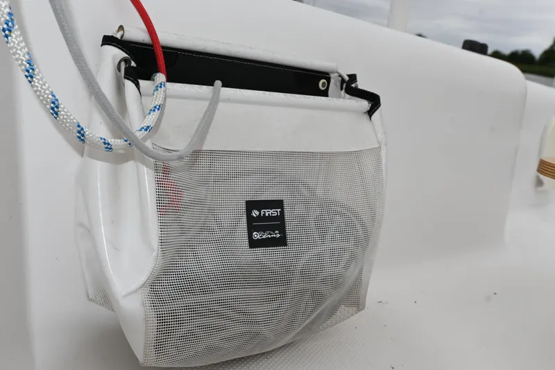Slide: The Image of Mesh storage bag on 2022 Beneteau First 24 sailboat, featuring ropes and accessories. - 16