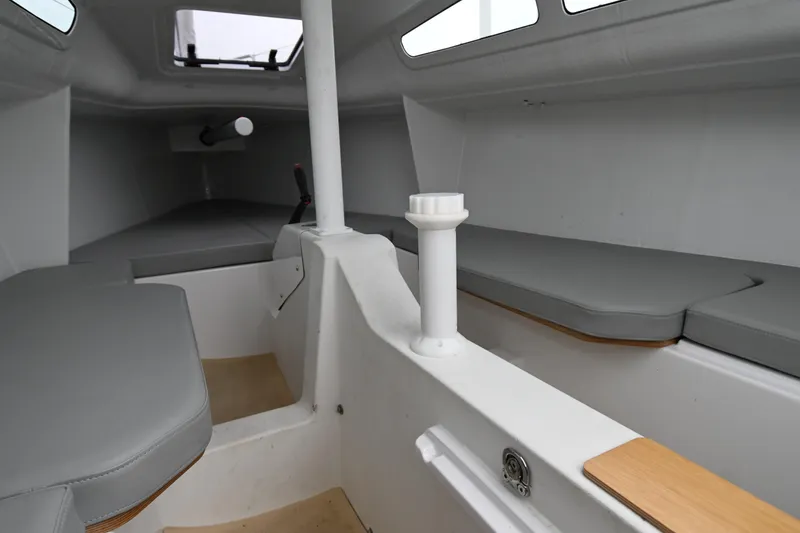 Slide: The Image of Interior of 2022 Beneteau First 24 sailboat, featuring sleek seating and modern design. - 21