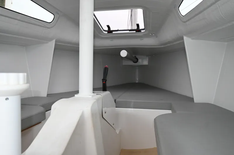 Slide: The Image of Interior of 2022 Beneteau First 24 sailboat, featuring sleek, modern design and comfortable seating. - 22