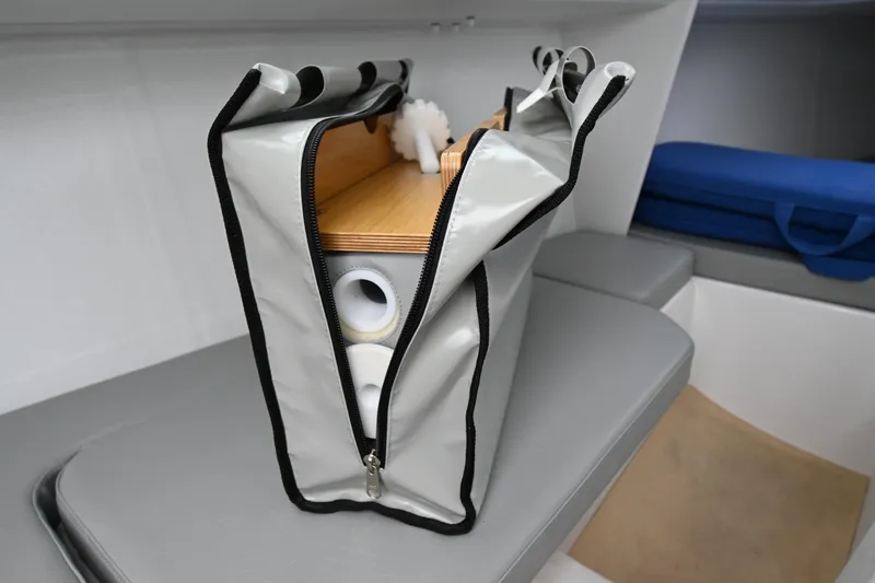 Slide: The Image of Interior of 2022 Beneteau First 24 sailboat with storage bag on seat. - 27