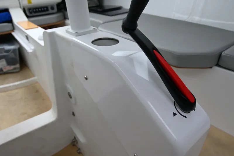 Slide: The Image of Interior view of 2022 Beneteau First 24 sailboat cockpit with control lever. - 29