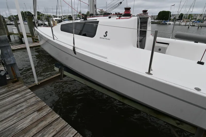 Slide: The Image of 2022 Beneteau First 24 sailboat docked at marina, side view. - 7