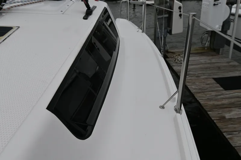Slide: The Image of 2022 Beneteau First 24 sailboat deck with sleek design and modern features. - 8