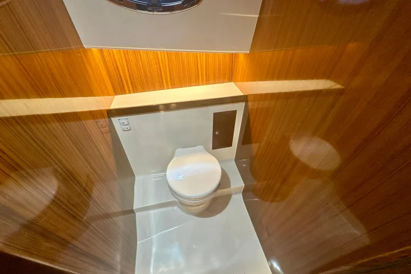Slide: The Image of Luxurious bathroom interior of 2024 DaVinci 30HT yacht with wood paneling. - 26