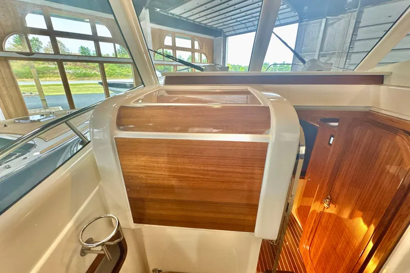 Slide: The Image of 2024 DaVinci 30HT yacht interior with polished wood and sleek design elements. - 43