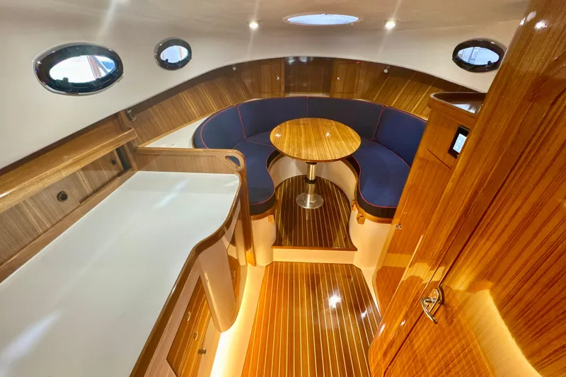 Slide: The Image of Luxurious 2024 DaVinci 30HT yacht interior with elegant wood finish and cozy seating area. - 45