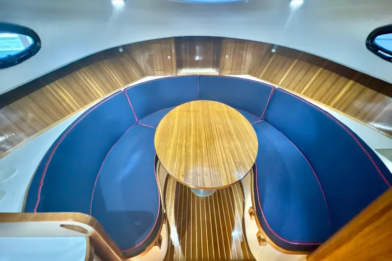 Slide: The Image of Luxurious interior of 2024 DaVinci 30HT yacht with elegant wood and blue seating. - 48