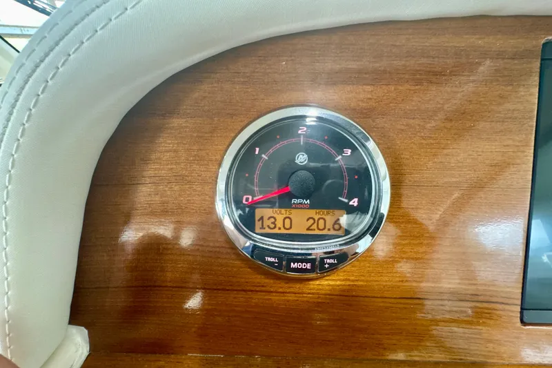 Slide: The Image of Tachometer on 2024 DaVinci 30HT boat dashboard, displaying RPM, volts, and hours. - 52