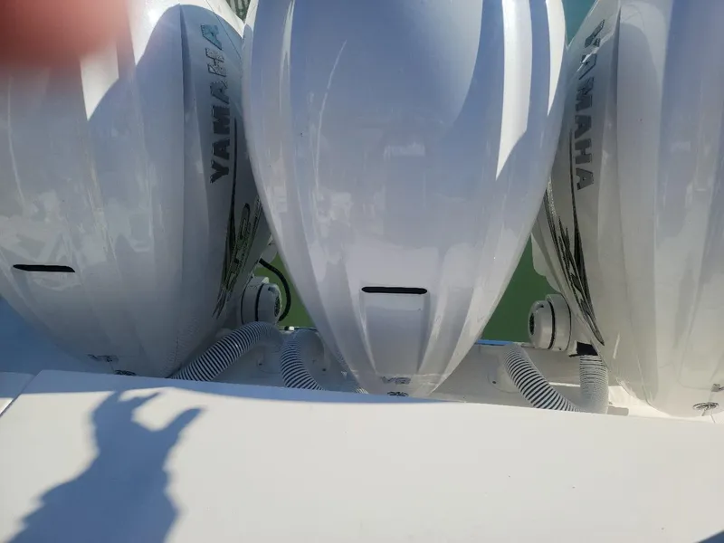 Slide: The Image of Triple Yamaha outboard engines on a 2021 Pursuit S 378 Sport boat. - 21