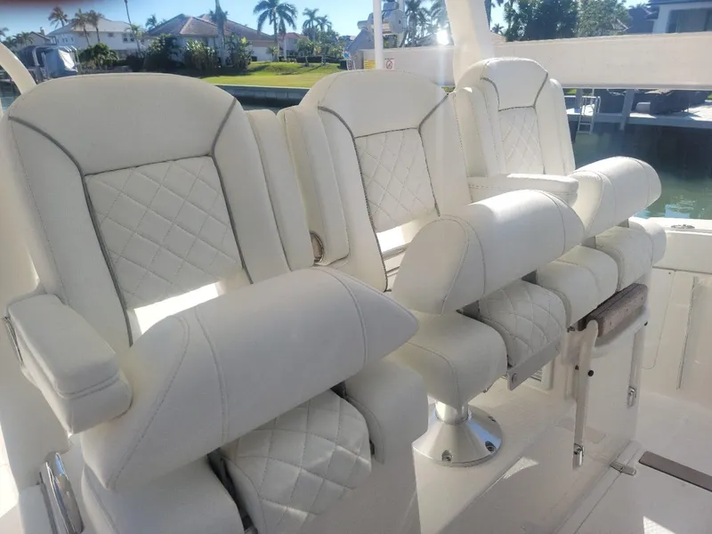 Slide: The Image of Luxurious white seating on 2021 Pursuit S 378 Sport boat. - 30