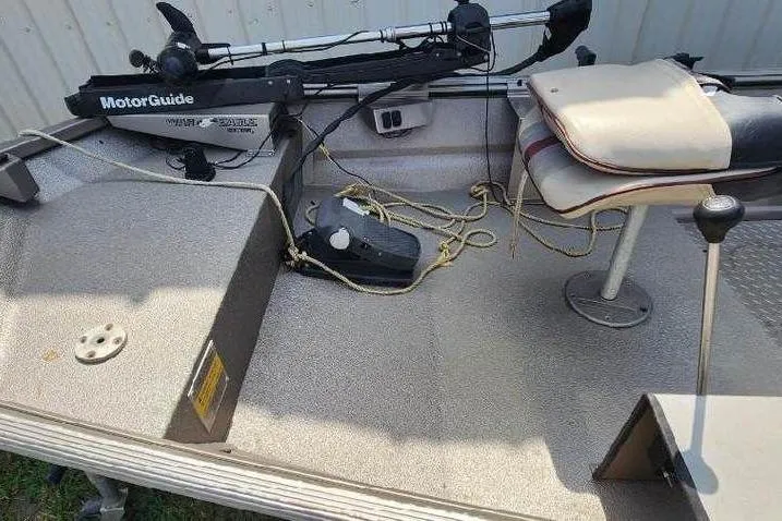 Slide: The Image of 2012 War Eagle 1642 Stick Steer boat interior with MotorGuide trolling motor and seating. - 6