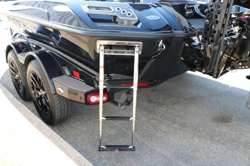 Slide: The Image of 2024 Vexus VXS 20 boat rear view with ladder and dual axle trailer. - 12