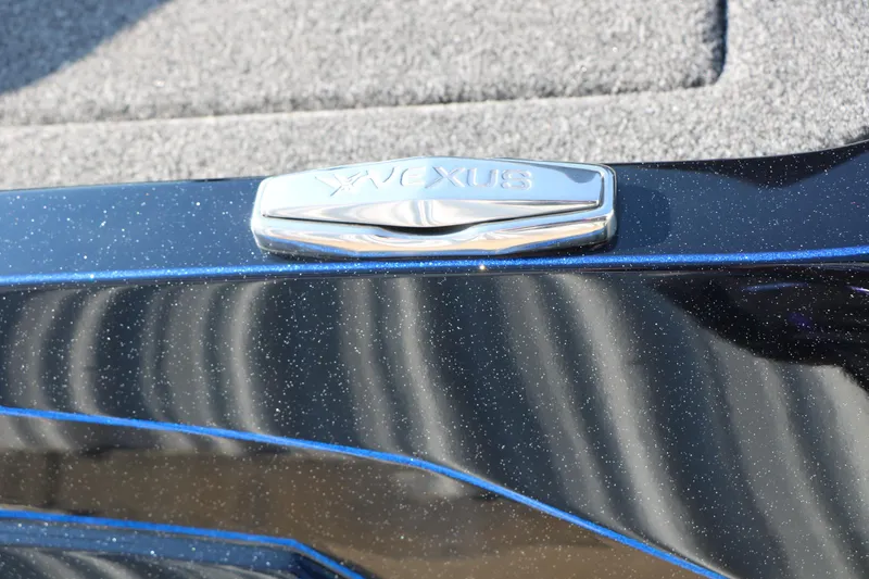 Slide: The Image of 2024 Vexus VXS 20 boat detail with metallic finish and logo. - 13