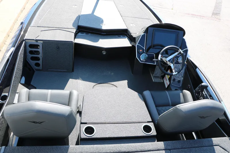 Slide: The Image of 2024 Vexus VXS 20 boat interior with dual seats, steering console, and storage compartments. - 21