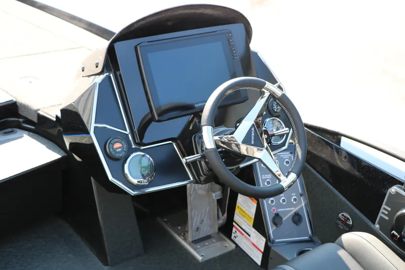 Slide: The Image of 2024 Vexus VXS 20 boat dashboard with steering wheel and digital display. - 22