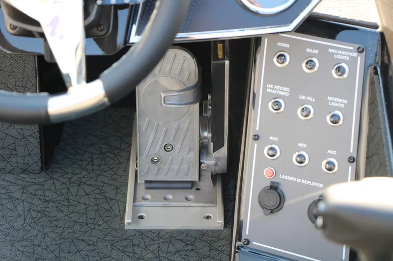 Slide: The Image of 2024 Vexus VXS 20 boat dashboard with steering wheel and control panel. - 25