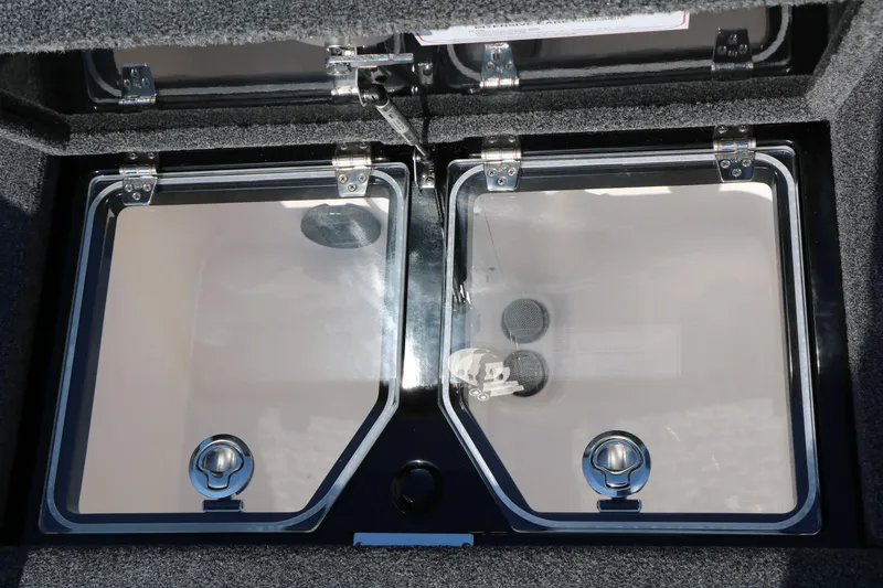 Slide: The Image of 2024 Vexus VXS 20 boat storage compartment with dual transparent lids and secure latches. - 38