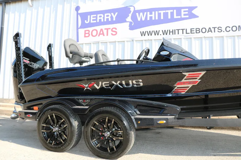 Slide: The Image of 2024 Vexus VXS 20 boat displayed at Jerry Whittle Boats dealership. - 6
