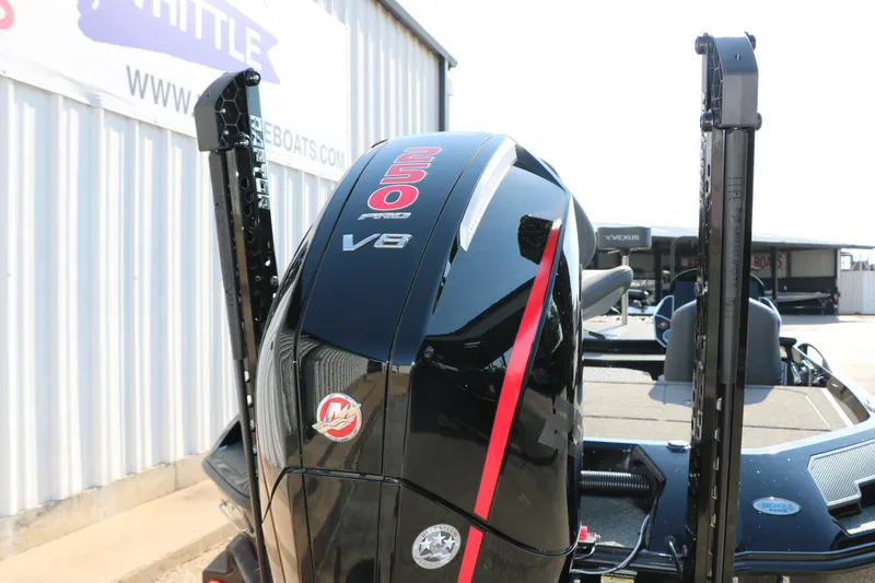 Slide: The Image of 2024 Vexus VXS 20 boat with powerful V8 engine, featuring sleek black and red design. - 9