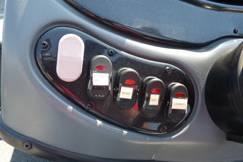 Slide: The Image of Control panel of a 2013 Lowe Stinger ST175 boat with labeled switches. - 15