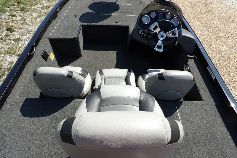 Slide: The Image of 2013 Lowe Stinger ST175 boat interior with steering console and seating. - 19