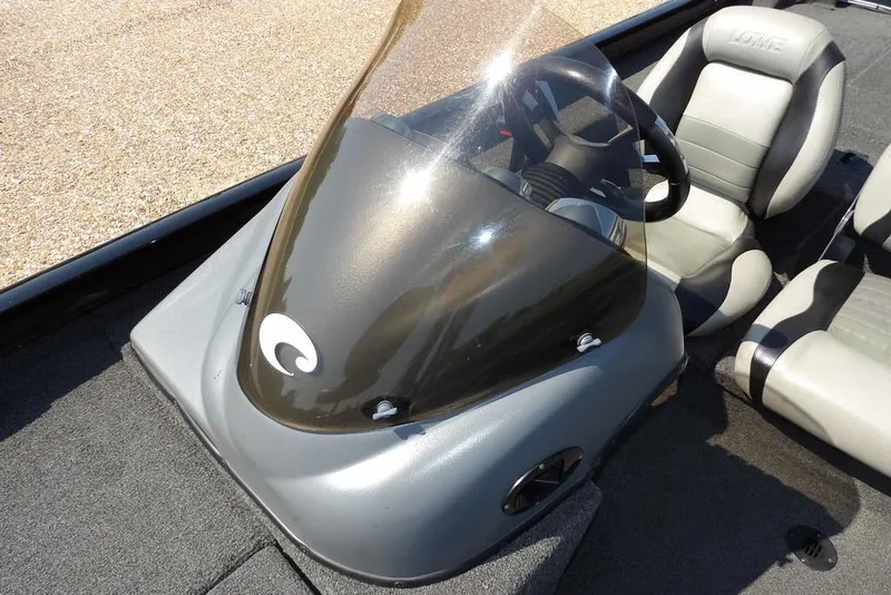 Slide: The Image of 2013 Lowe Stinger ST175 boat interior with steering wheel and seats. - 21