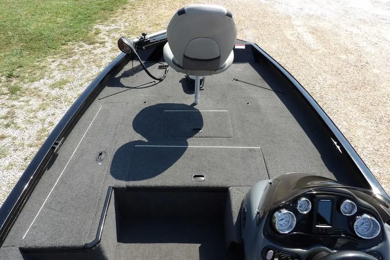 Slide: The Image of 2013 Lowe Stinger ST175 boat interior with seating and control panel. - 22