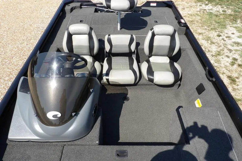 Slide: The Image of 2013 Lowe Stinger ST175 boat interior with three seats and steering console. - 25