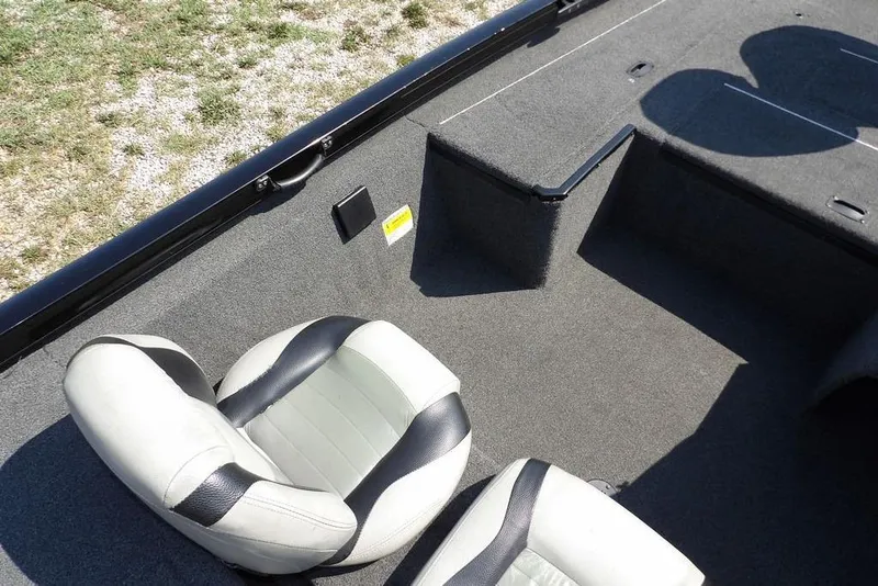 Slide: The Image of Interior of 2013 Lowe Stinger ST175 boat with two seats and carpeted flooring. - 26