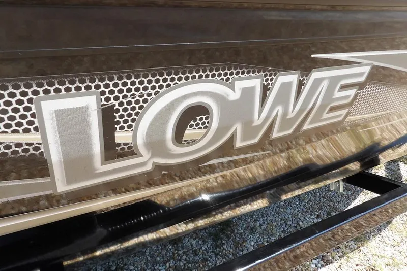Slide: The Image of Close-up of 2013 Lowe Stinger ST175 logo with textured background. - 42