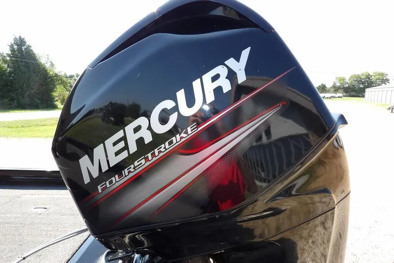 Slide: The Image of Mercury FourStroke engine on 2013 Lowe Stinger ST175 boat, outdoors. - 44