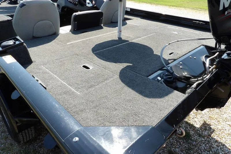 Slide: The Image of 2013 Lowe Stinger ST175 boat interior with carpeted deck and seating. - 5