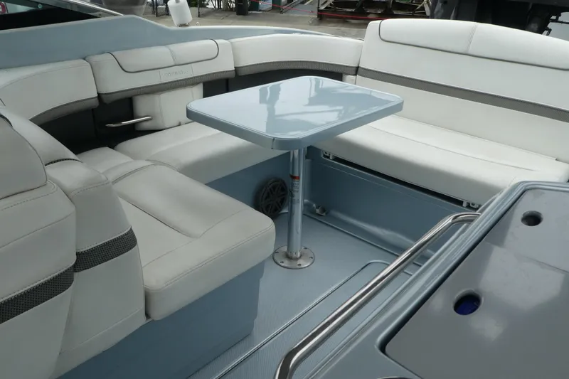 Slide: The Image of 2014 Formula 290 Sun Sport boat interior with white seating and a central table. - 12