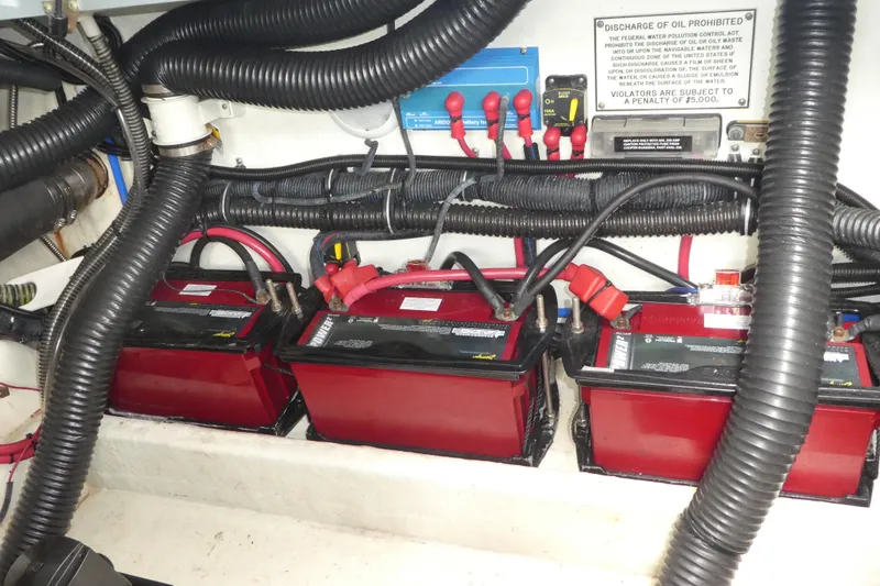 Slide: The Image of 2014 Formula 290 Sun Sport boat battery compartment with red batteries and wiring. - 18