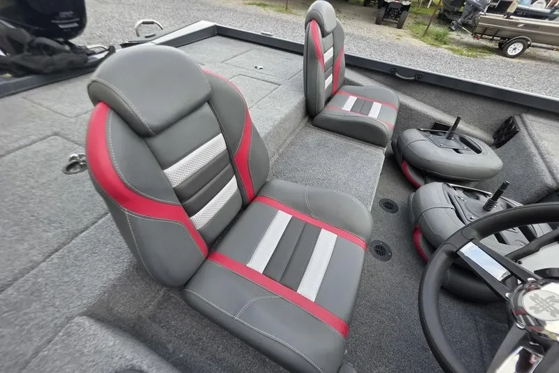 Slide: The Image of 2022 Ranger RT188P boat interior with gray and red seats, steering wheel visible. - 11