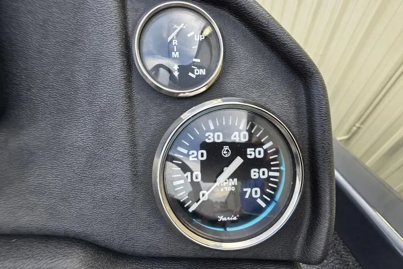 Slide: The Image of Dashboard gauges of 2022 Ranger RT188P boat, showing RPM and trim indicators. - 12